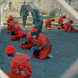 Camp X-Ray (Gitmo) detainees, 1/11/2002, Source: Wikipedia